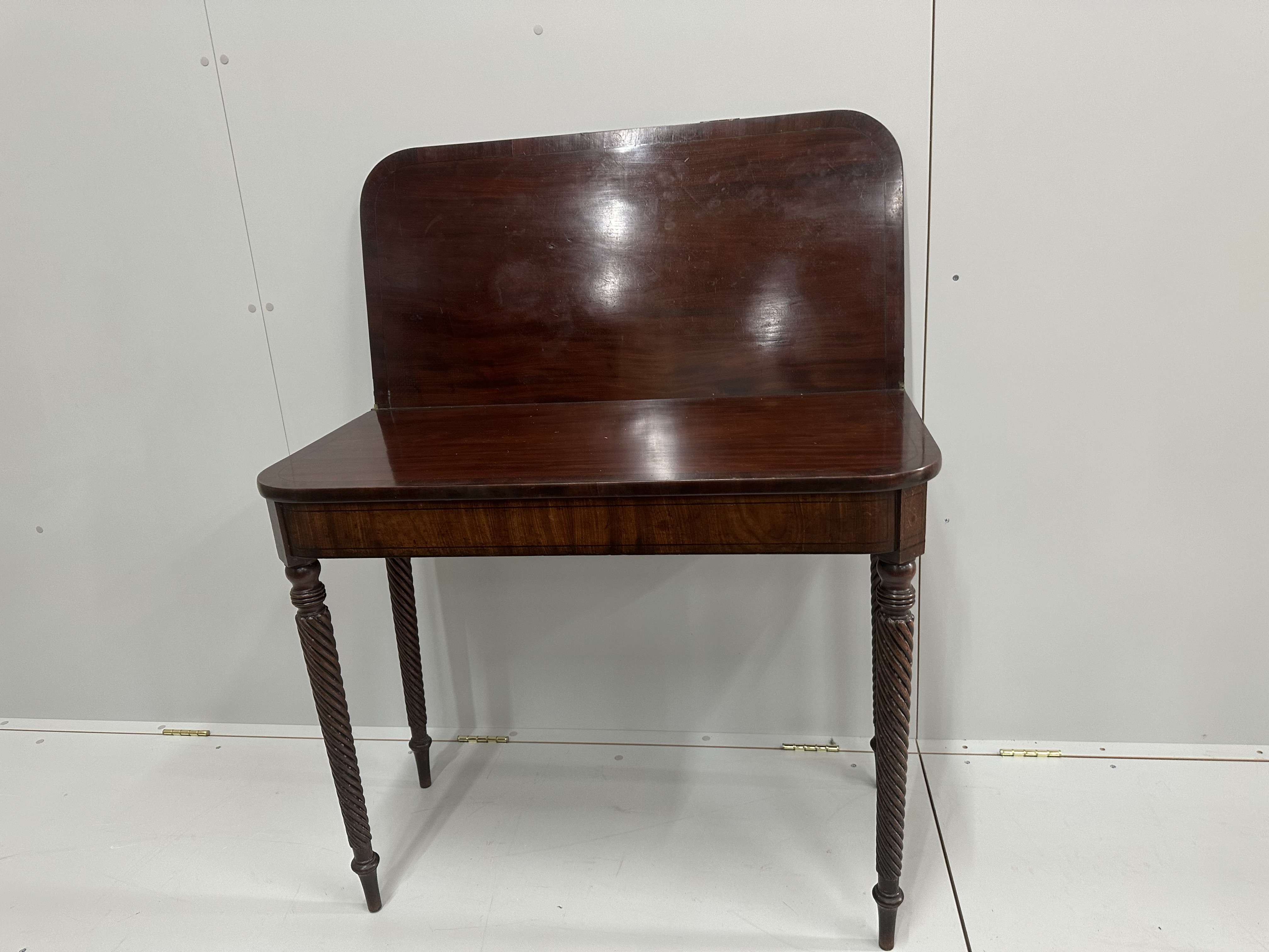 A George IV mahogany folding tea table, width 92cm, depth 46cm, height 76cm